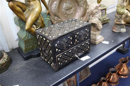 An 18th century Indo-Portuguese ebony, tortoiseshell and bone inlaid table top chest, 14.5in.